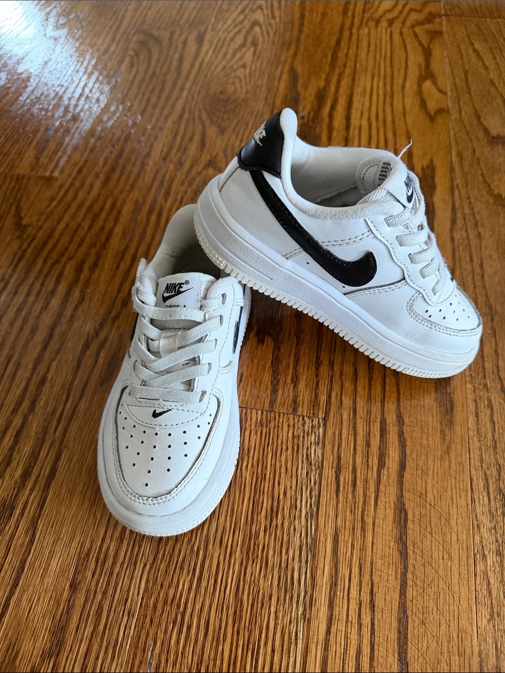 Nike Kids White Sneakers with Black Swoosh